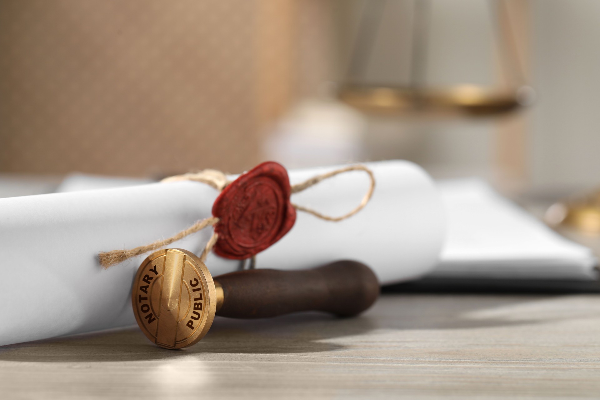 Public notary. Document with wax stamp on wooden table, closeup